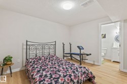 Well-lit room featuring light-toned wood-finish flooring and a neutral color palette - 