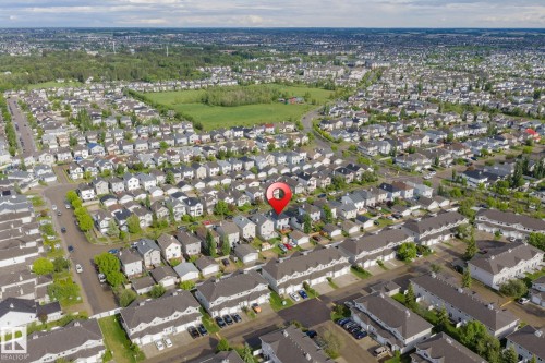 Aerial view of a residential neighborhood with detached homes and townhomes - 220 85St, Edmonton, AB 