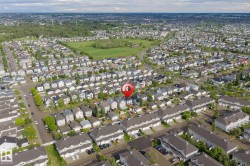 Aerial view of a residential neighborhood with detached homes and townhomes - 