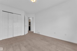 Room featuring neutral carpeting and white wall paint - 
