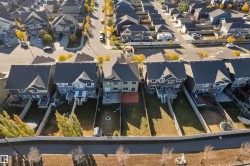 Residential property featuring a rear deck with pergola, private fenced yard, and direct access to a paved walking path - 