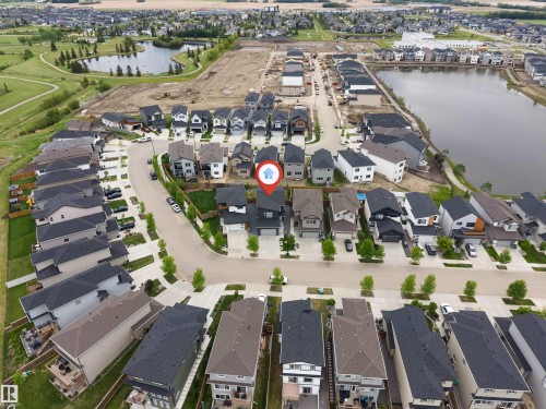 Aerial view showcasing a modern residential development with varied architectural styles - 6203 47 Avenue, Beaumont, AB 