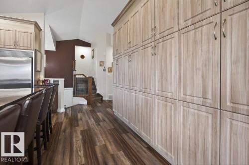 Expansive floor-to-ceiling cabinetry with wood-finish doors - 71 Ratelle Circle, St. Albert, AB 