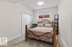 Neutral wall paint, light gray carpet flooring, white baseboards, and a window with blinds - 