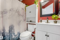 White vanity with integrated sink and dark bronze faucet - 