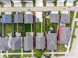 Aerial view showcasing a residential property with a defined lot perimeter - 