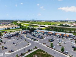 Retail plaza with multiple tenant spaces, ample surface parking, and direct highway access - 