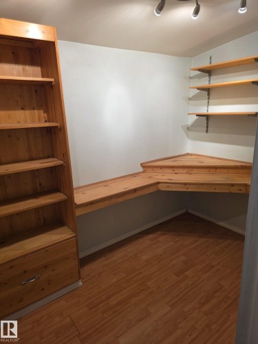 Dedicated workspace featuring wood-finish flooring and track lighting - 35 10331 106 Street, Edmonton, AB 