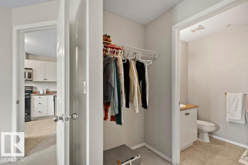 Entryway featuring a built-in closet with wire shelving - 232 4309 33 Street, Stony Plain, AB 
