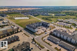 Aerial perspective showcasing a residential and commercial district with diverse architecture - 