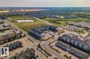 Aerial perspective showcasing a residential and commercial district with diverse architecture - 232 4309 33 Street, Stony Plain, AB 