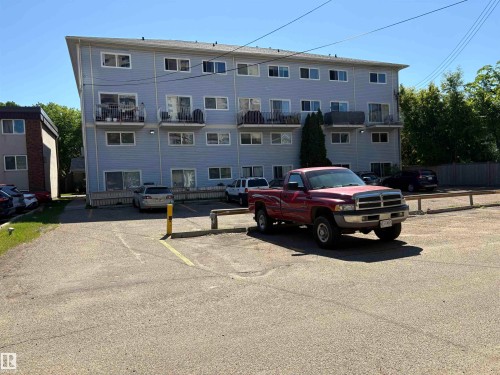 parking beside the red truck and yellow post - 3 10324 119 Street, Edmonton, AB 
