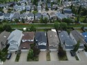 Aerial perspective showcasing multiple detached residences with varied rooflines and exterior finishes - 21113 92A Avenue Nw, Edmonton, AB 
