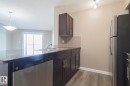 #313 1510 Watt Dr Sw, Edmonton, AB  - Indoor Photo Showing Kitchen With Double Sink 