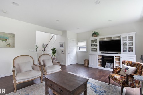 Living area featuring wide plank wood-finish flooring and recessed lighting - 34 Falcon Road, Cold Lake, AB 