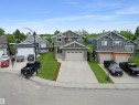 Contemporary two-story residence with a multi-gabled roofline and a neutral siding exterior - 34 Falcon Road, Cold Lake, AB 