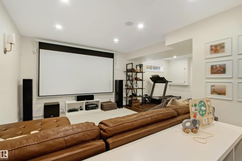 Recreational space featuring a large projection screen, recessed lighting, and wall-mounted sconces - 34 Falcon Road, Cold Lake, AB 