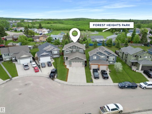 Modern two-story residence with a gray exterior and white trim accents - 34 Falcon Road, Cold Lake, AB 
