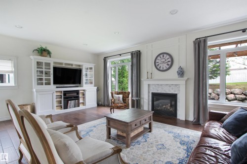Spacious living area featuring wood-finish flooring and recessed lighting - 34 Falcon Road, Cold Lake, AB 