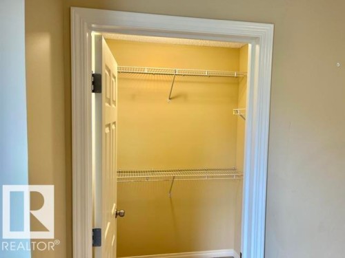 Interior closet featuring wire shelving - 1 5281 Terwillegar Boulevard, Edmonton, AB 