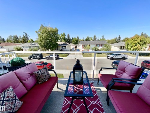 Outdoor balcony featuring a glass railing system and a concrete floor - 11031 166 Avenue, Edmonton, AB 