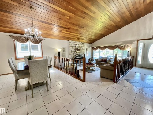 Vaulted wood-paneled ceiling with an ornate chandelier - 11031 166 Avenue, Edmonton, AB 