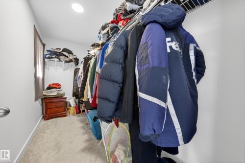 Walk-in closet with carpet flooring, recessed lighting, and a wire shelving system - 1684 12 Street, Edmonton, AB 