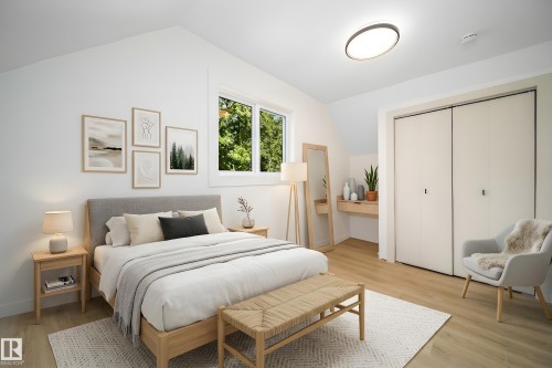 Bright bedroom featuring a vaulted ceiling and light wood-finish flooring - 10866 92 Street, Edmonton, AB 