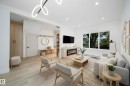Bright living area featuring wood-finish flooring and recessed lighting - 10866 92 Street, Edmonton, AB 