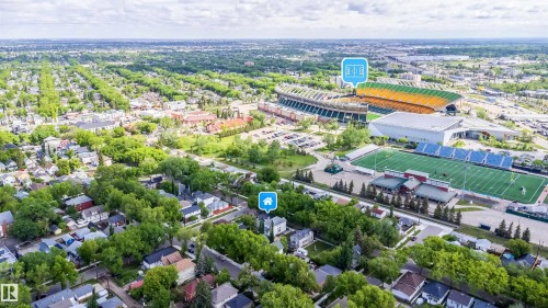 Aerial perspective of a residential area featuring single-family homes and abundant mature trees - 10866 92 Street, Edmonton, AB 