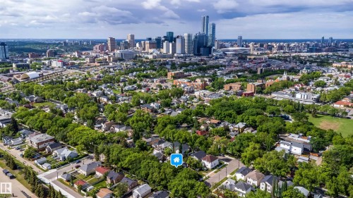 Aerial perspective showcasing an urban residential neighborhood with mature tree canopies - 10866 92 Street, Edmonton, AB 