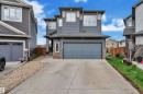 Contemporary two-story exterior with horizontal siding and stacked stone accents - 17551 64 Street, Edmonton, AB 