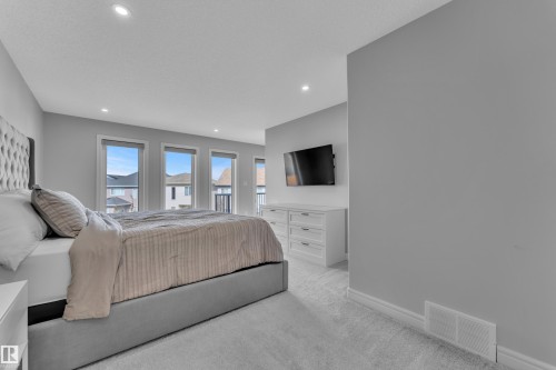 Spacious room featuring light gray walls and plush carpeting - 17551 64 Street, Edmonton, AB 