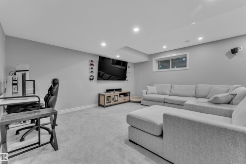 Spacious room featuring light gray walls and plush gray carpeting - 17551 64 Street, Edmonton, AB 