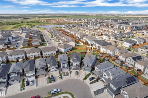 Residential neighborhood featuring contemporary housing styles, a nearby water body, and established landscaping - 17551 64 Street, Edmonton, AB 