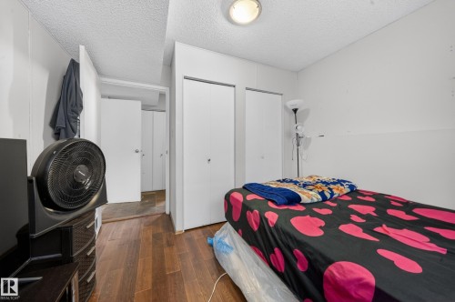 Room featuring wood-finish flooring and white walls - 2832 35 Street, Edmonton, AB 