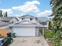 Two-story residence featuring a front-facing attached garage with a double-wide driveway - 2832 35 Street, Edmonton, AB 