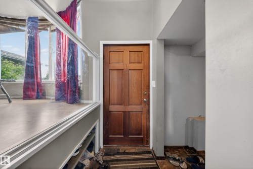 Paneled wood entry door with brass hardware - 2832 35 Street, Edmonton, AB 