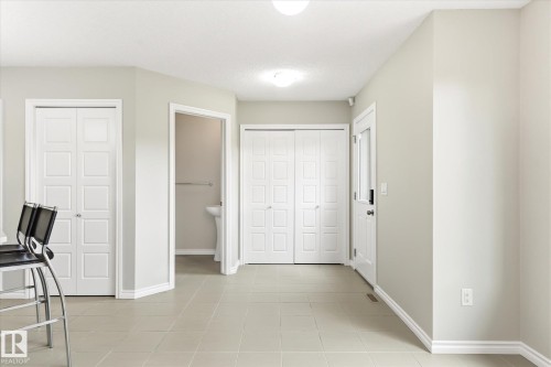 Light-toned tile flooring throughout - 9039 219 Street, Edmonton, AB 