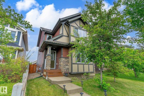 Two-story residence featuring a combination of siding and stone veneer on the exterior - 9039 219 Street, Edmonton, AB 