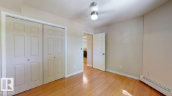 Light wood-finish flooring complements the neutral wall tones - 