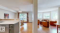 Open-concept living space featuring wood-finish flooring, a kitchen peninsula with countertop seating, and a stainless steel dishwasher - 