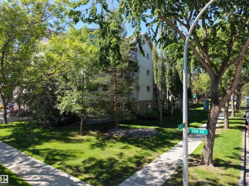 Multi-story residential building featuring balconies and a prominent gabled roofline - 201 11408 108 Avenue, Edmonton, AB 