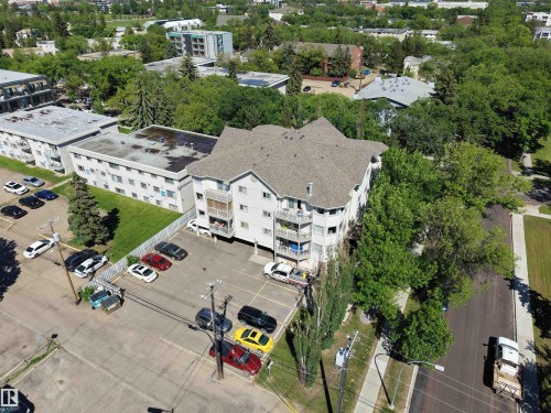 Multi-story residential building featuring a gabled roofline and multiple balconies - 201 11408 108 Avenue, Edmonton, AB 