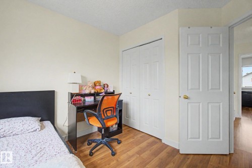 Room with light-toned walls and wood-finish flooring - 710 Glenwright Court, Edmonton, AB 