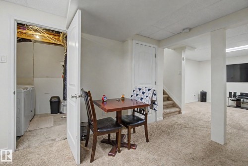 Basement space featuring carpet flooring and white painted walls - 710 Glenwright Court, Edmonton, AB 