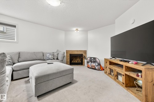 100 Napoleon Crescent, St. Albert, AB - Indoor Photo Showing Living Room With Fireplace