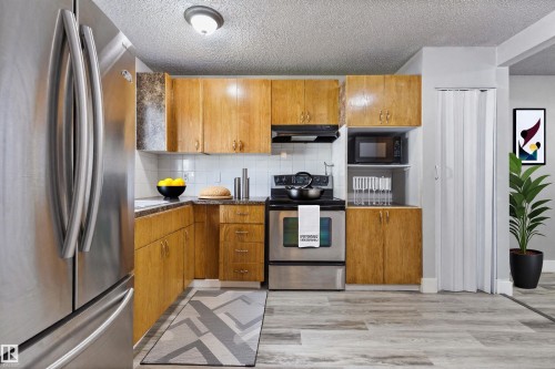 Virtually stagged kitchen - 75 Mcleod Place, Edmonton, AB 