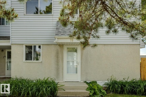 White siding exterior with a stucco lower level - 75 Mcleod Place, Edmonton, AB 