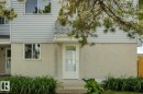 White siding exterior with a stucco lower level - 75 Mcleod Place, Edmonton, AB 